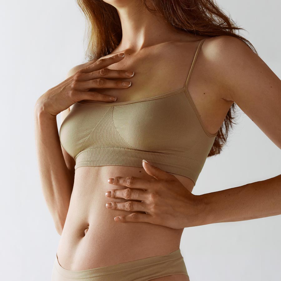 Blonde smiling woman year with clean fresh face and hands wit