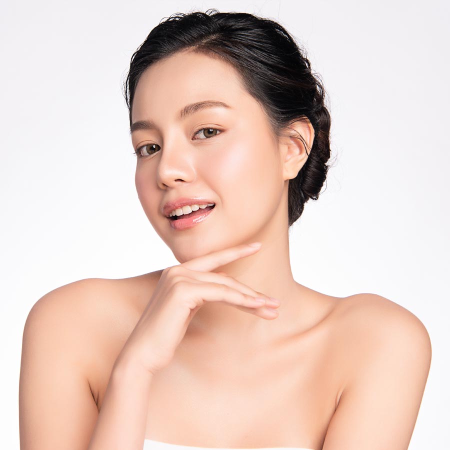 Blonde smiling woman year with clean fresh face and hands wit